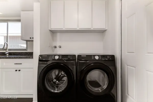 a utility room with dryer and washer