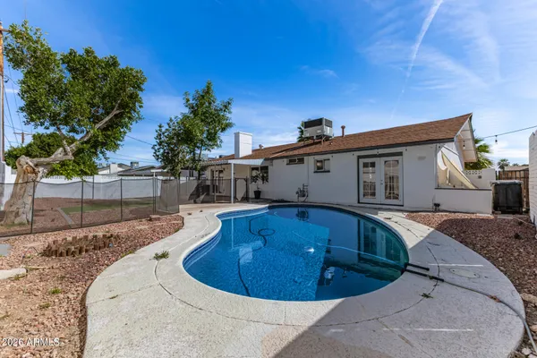 a view of a house with swimming pool