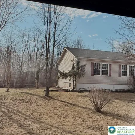 a view of a house with a snow