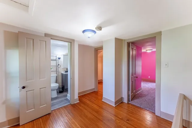 a view of a livingroom with wooden floor