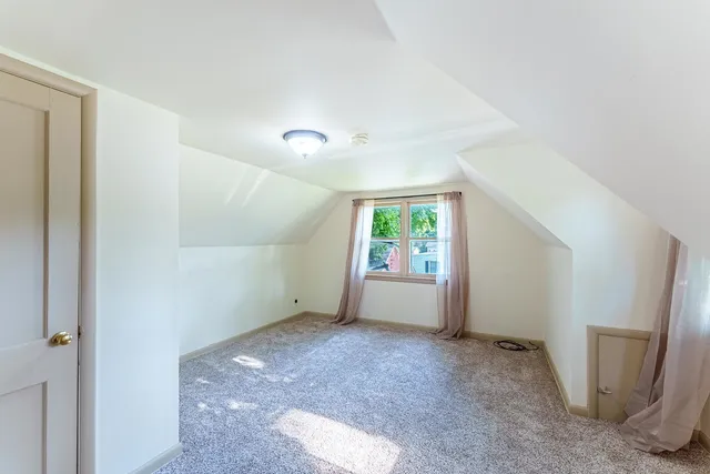 a view of room with window and bathroom
