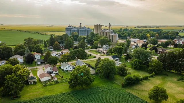 an aerial view of a house with big yard