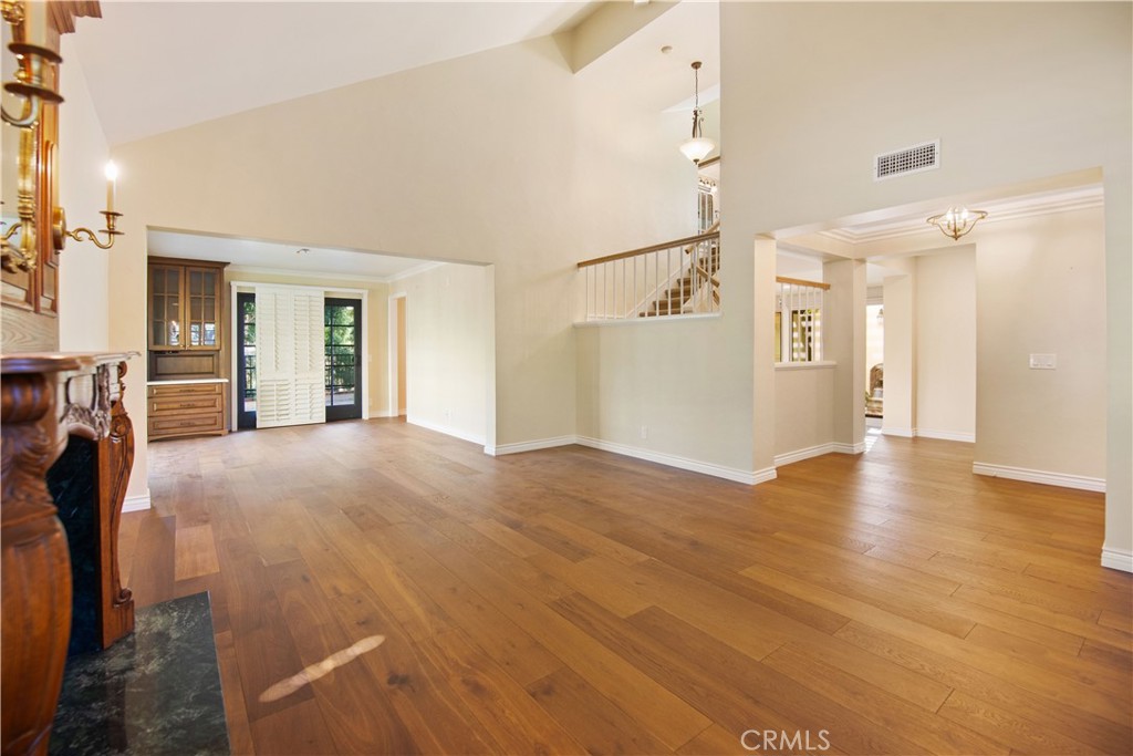 24965 Danamaple Dana Point, CA 92629 - Photo 18 of 72 a view of a big room with wooden floor and windows