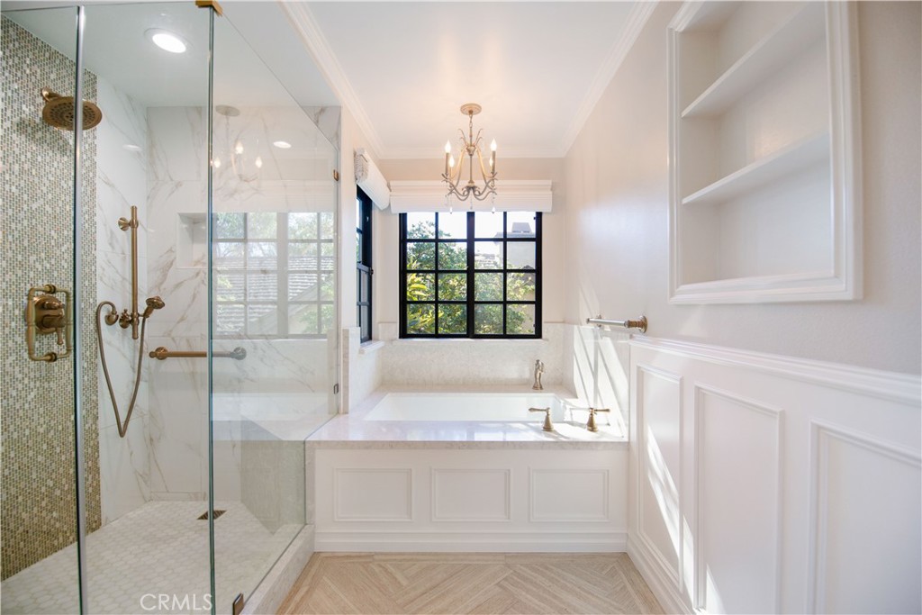 24965 Danamaple Dana Point, CA 92629 - Photo 27 of 72 a bathroom with a granite countertop sink a mirror and shower