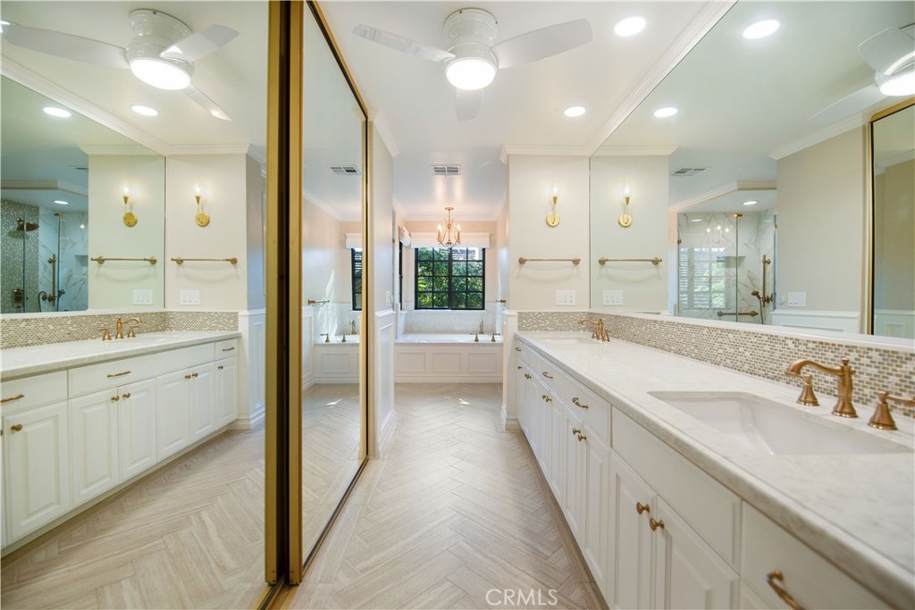 24965 Danamaple Dana Point, CA 92629 - Photo 30 of 72 a spacious bathroom with a double vanity sink a mirror and a shower