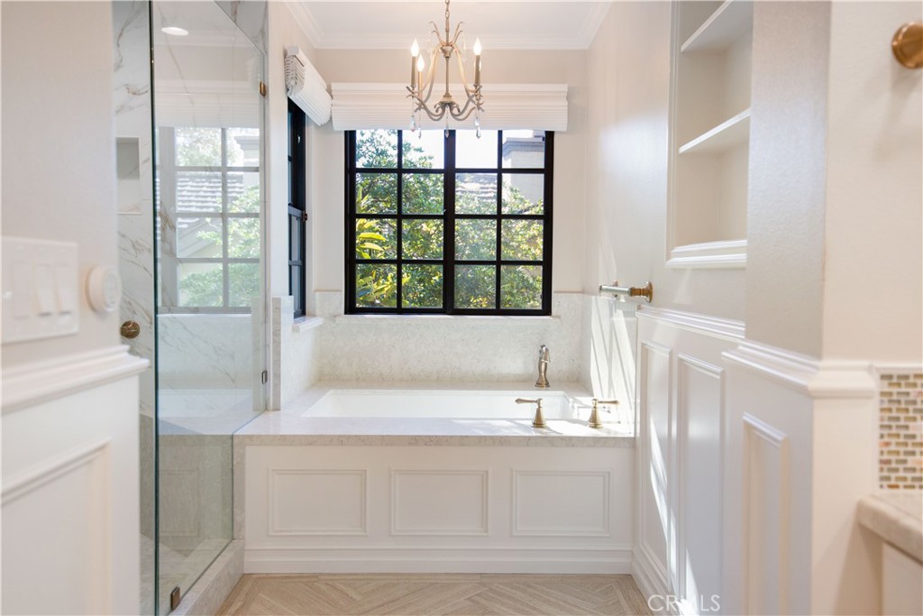 24965 Danamaple Dana Point, CA 92629 - Photo 31 of 72 a bathroom with a tub sink and mirror