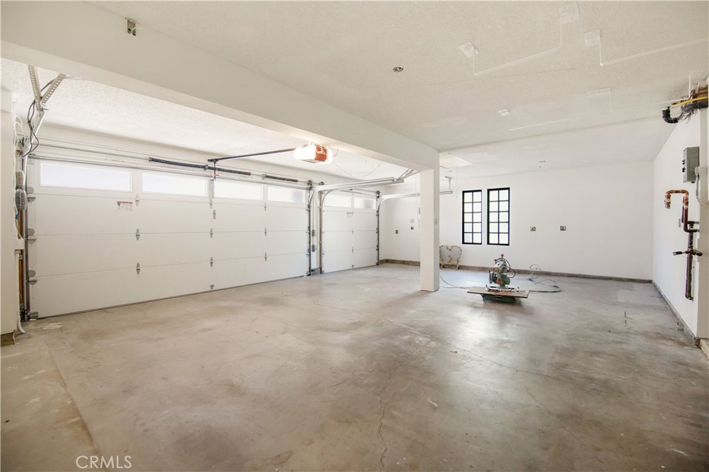 24965 Danamaple Dana Point, CA 92629 - Photo 39 of 72 an empty room with a empty space and wooden floor