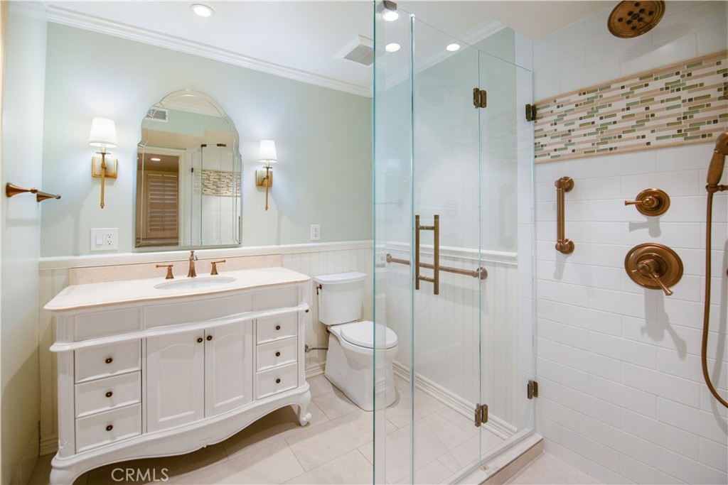 24965 Danamaple Dana Point, CA 92629 - Photo 45 of 72 a spacious bathroom with a granite countertop sink mirror and vanity