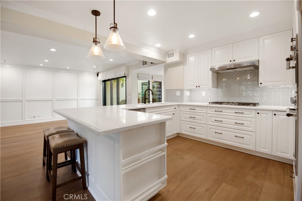 24965 Danamaple Dana Point, CA 92629 - Photo 5 of 72 a kitchen with stainless steel appliances kitchen island granite countertop a sink and cabinets