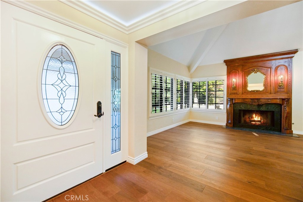 24965 Danamaple Dana Point, CA 92629 - Photo 8 of 72 a view of a livingroom with wooden floor and a fireplace