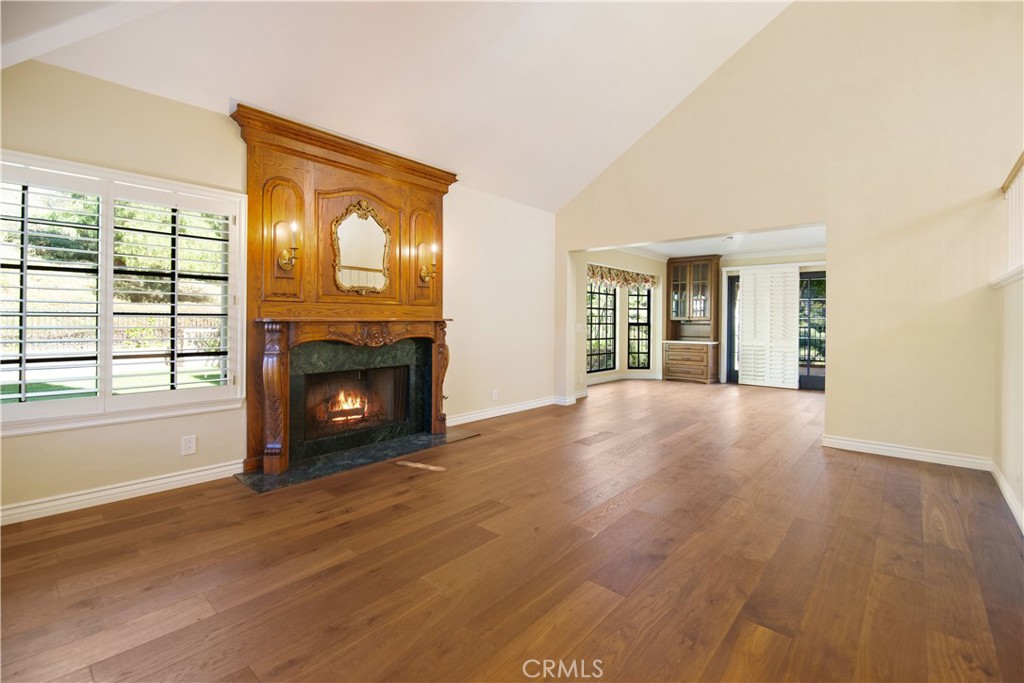 24965 Danamaple Dana Point, CA 92629 - Photo 9 of 72 a view of an empty room with a fireplace and a window