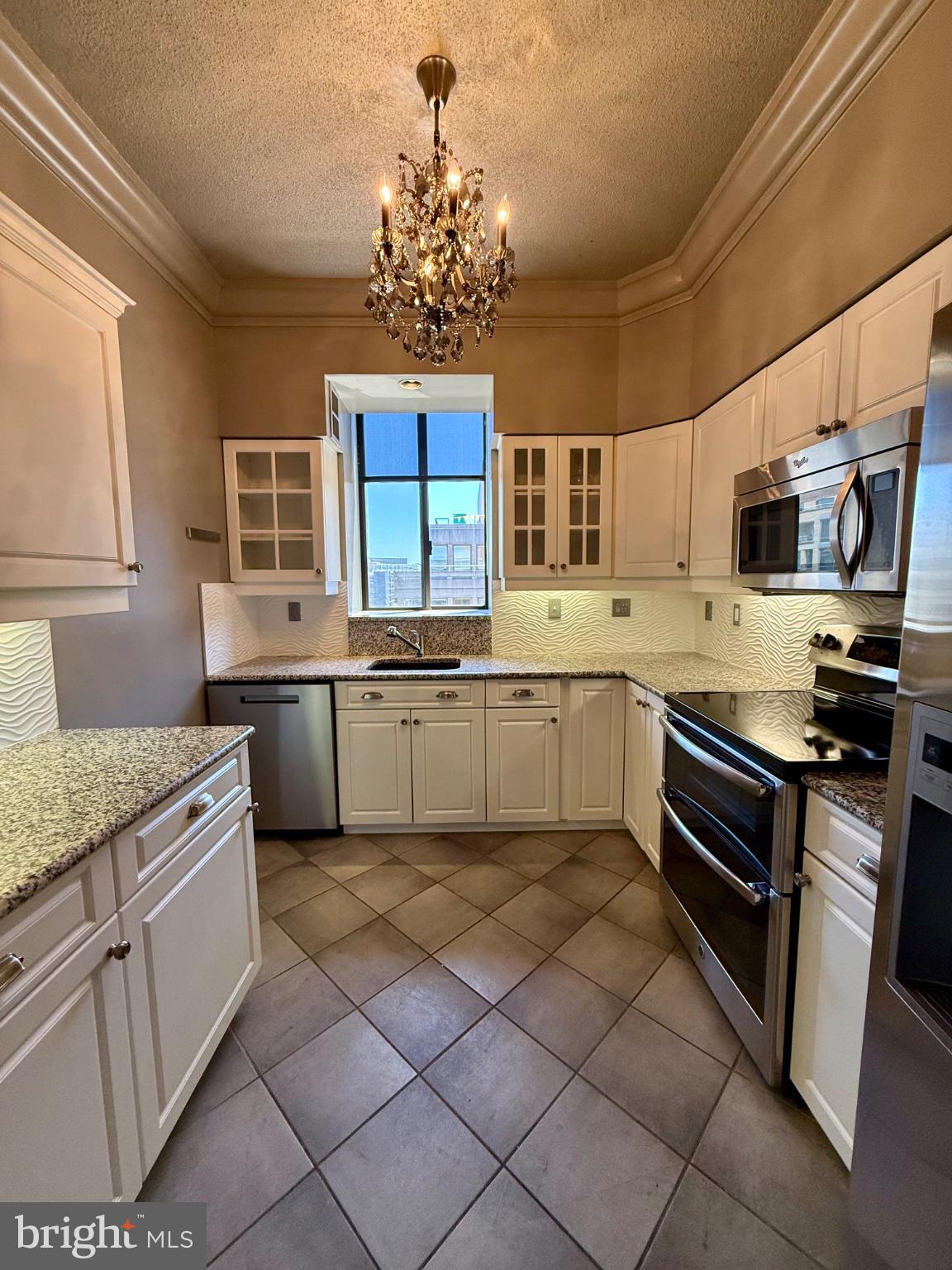 1200 23rd Street Northwest, Unit 910 Washington, DC 20037 - Photo 45 of 45 Elegant kitchen with modern charm.