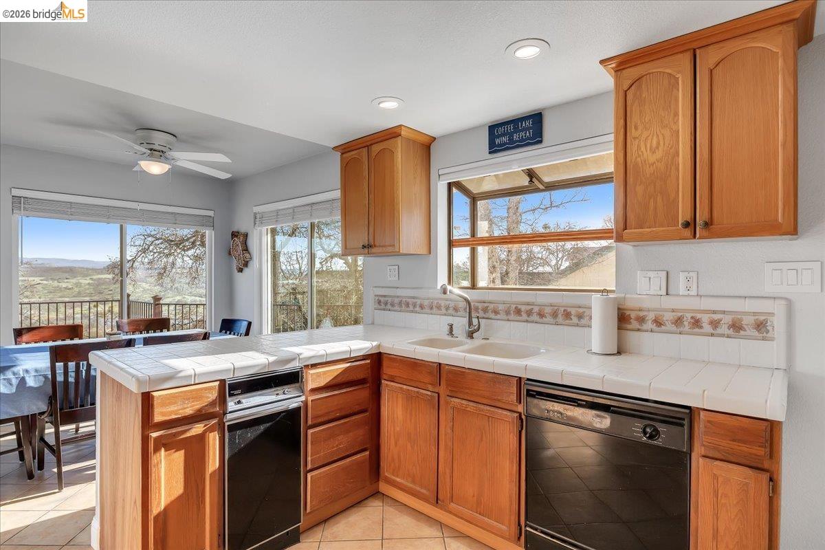 4620 Bayview Drive Copperopolis, CA 95228 - Photo 15 of 59 a kitchen with stainless steel appliances granite countertop a sink stove and cabinets