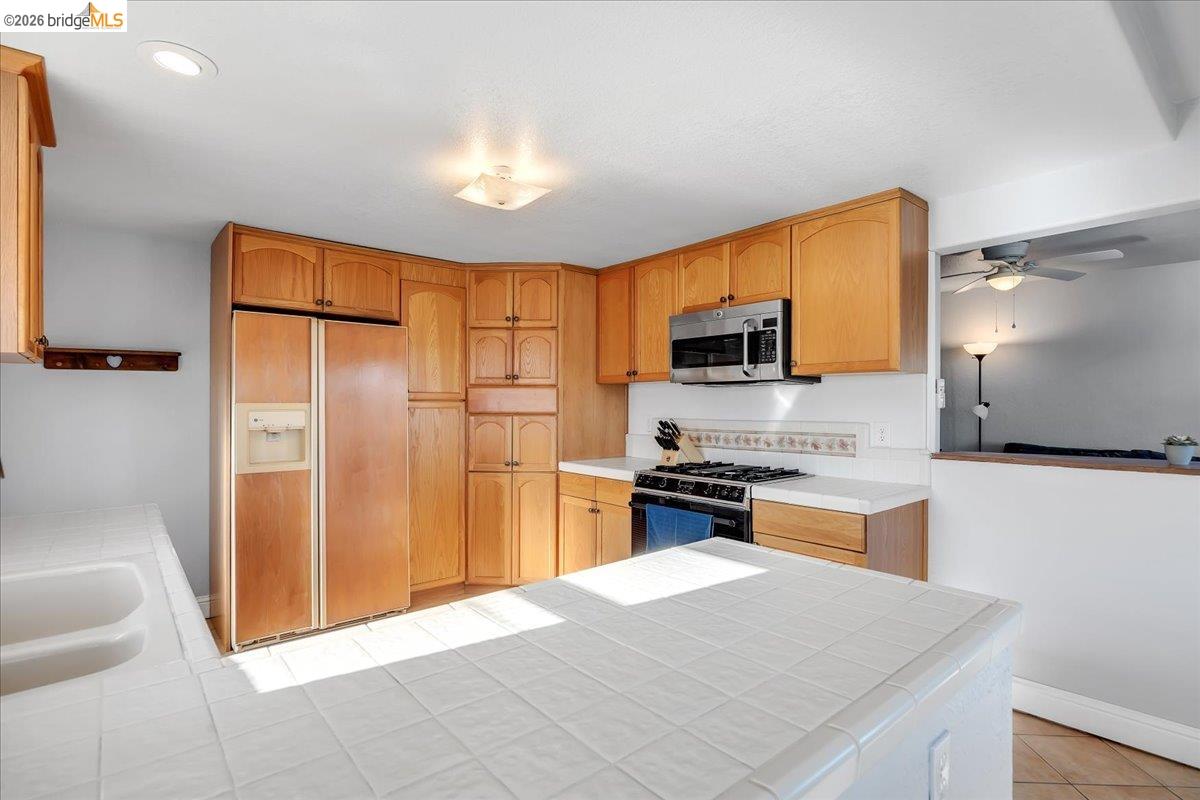 4620 Bayview Drive Copperopolis, CA 95228 - Photo 18 of 59 a kitchen with stainless steel appliances granite countertop a refrigerator stove top oven and sink