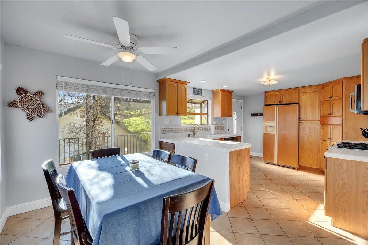 4620 Bayview Drive Copperopolis, CA 95228 - Photo 21 of 59 a view of a dining room with furniture window and outside view