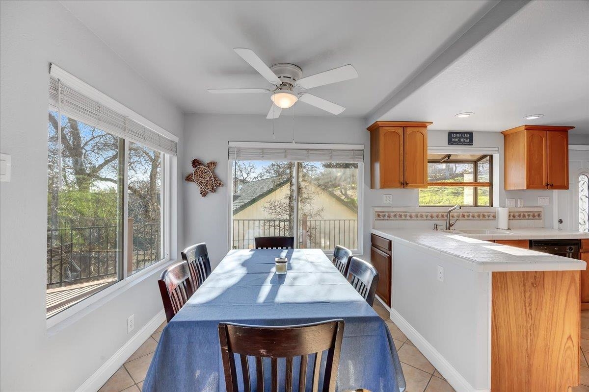 4620 Bayview Drive Copperopolis, CA 95228 - Photo 22 of 59 a view of a kitchen with kitchen island a large window a sink and a refrigerator