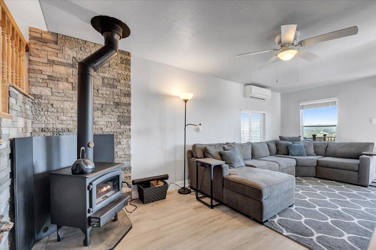 4620 Bayview Drive Copperopolis, CA 95228 - Photo 24 of 59 a living room with furniture and a fireplace