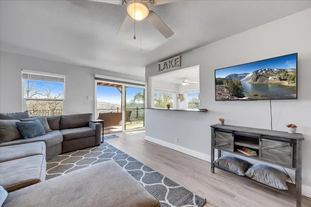 a bathroom with a sink a toilet and shower curtain