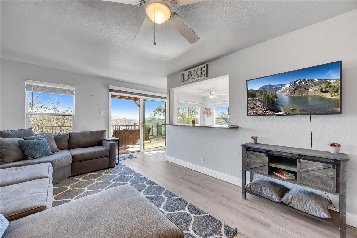 4620 Bayview Drive Copperopolis, CA 95228 - Photo 25 of 59 a living room with furniture and a flat screen tv
