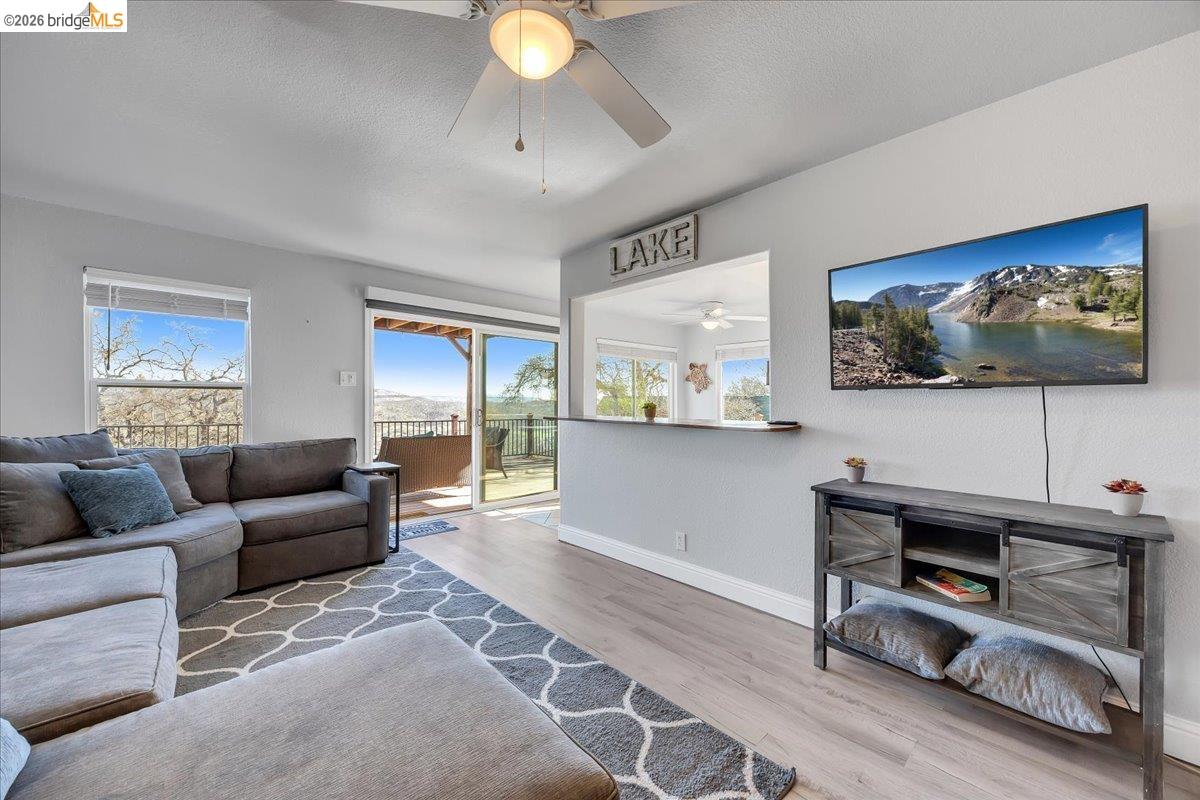 4620 Bayview Drive Copperopolis, CA 95228 - Photo 25 of 59 a living room with furniture and a flat screen tv