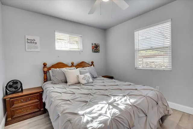 a bedroom with a bed and a window