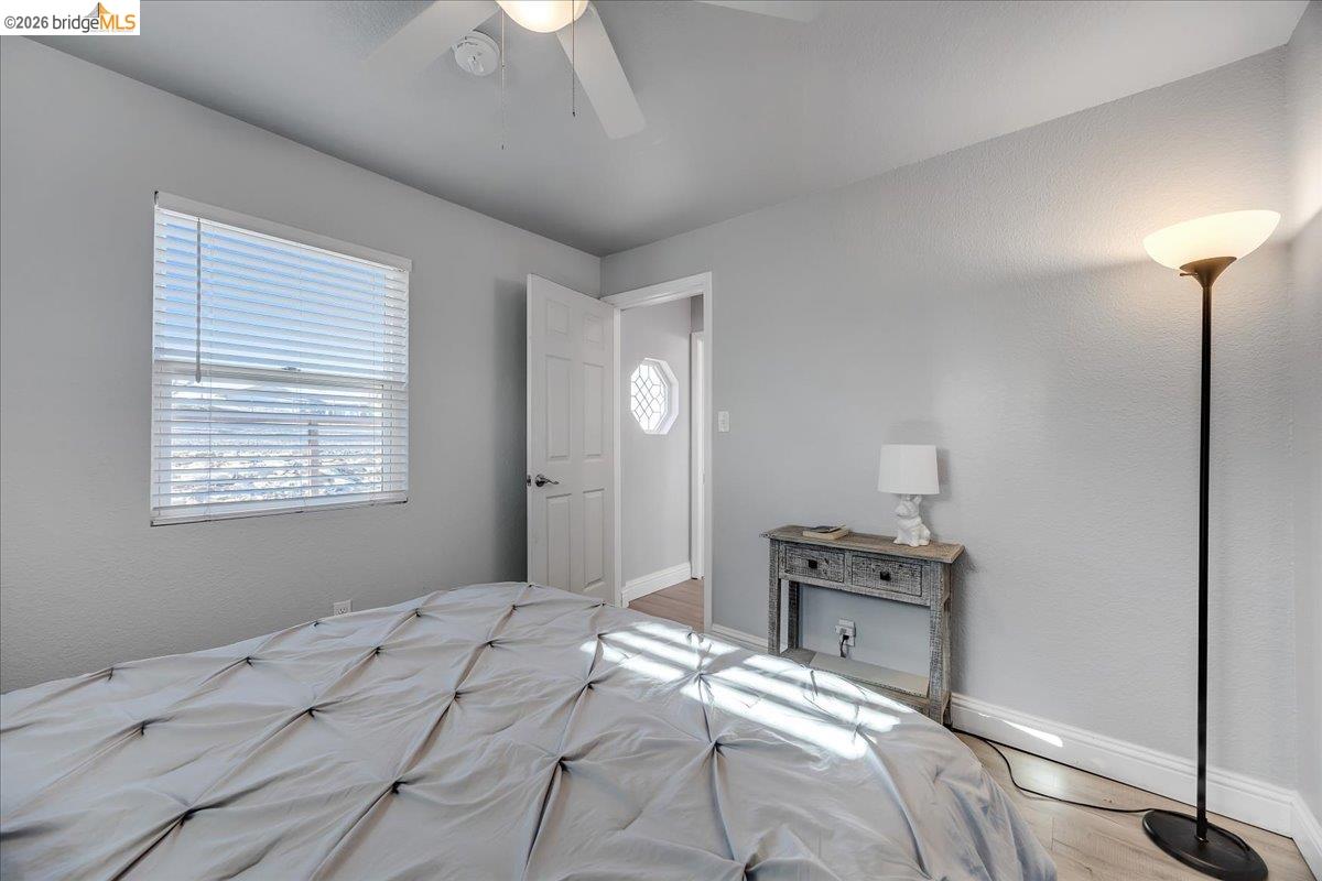 4620 Bayview Drive Copperopolis, CA 95228 - Photo 28 of 59 a bedroom with a bed and a chandelier