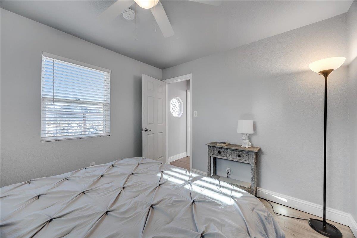 4620 Bayview Drive Copperopolis, CA 95228 - Photo 28 of 59 a bedroom with a bed and a chandelier