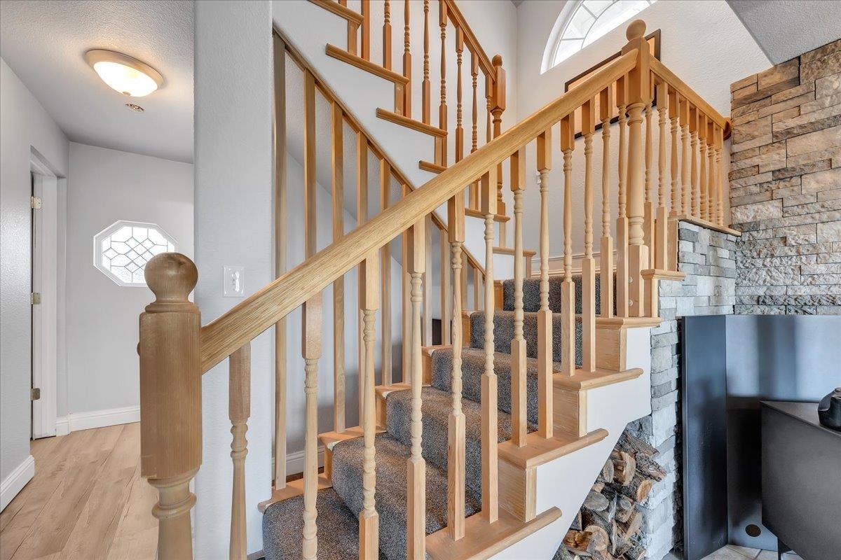 4620 Bayview Drive Copperopolis, CA 95228 - Photo 30 of 59 a view of staircase with railing and a chandelier