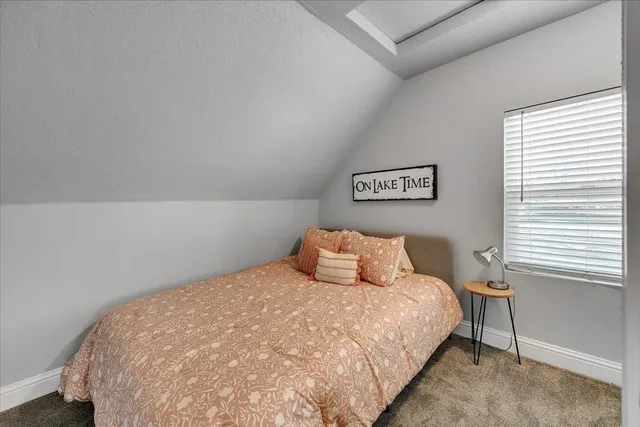 a bedroom with furniture and a ceiling fan