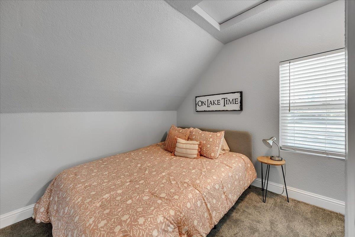4620 Bayview Drive Copperopolis, CA 95228 - Photo 31 of 59 a bedroom with a bed and a window