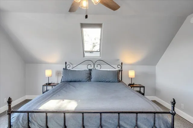 a view of livingroom with furniture and chandelier fan