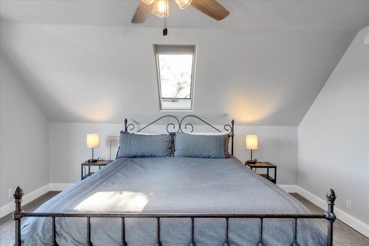 4620 Bayview Drive Copperopolis, CA 95228 - Photo 36 of 59 a bedroom with a bed and a chandelier