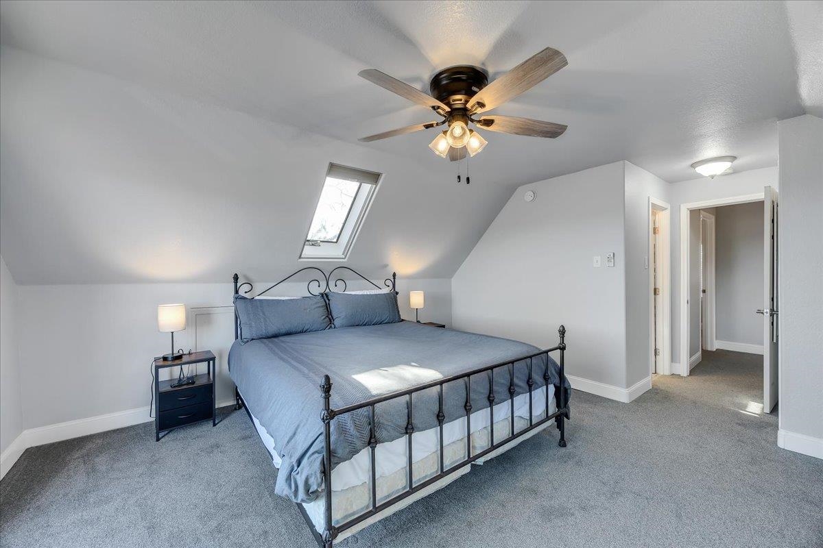 4620 Bayview Drive Copperopolis, CA 95228 - Photo 37 of 59 a bedroom with a bed and a chandelier