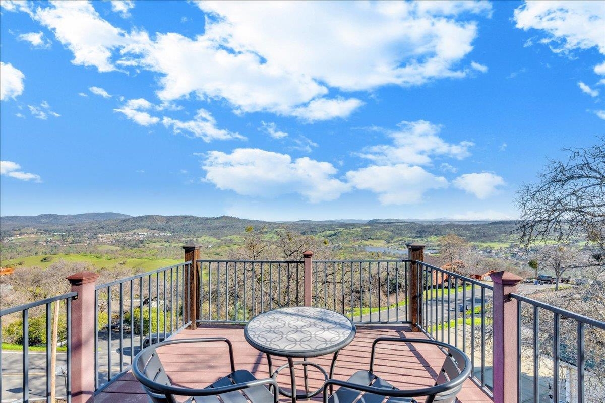 4620 Bayview Drive Copperopolis, CA 95228 - Photo 39 of 59 a view of a balcony with chair and wooden floor