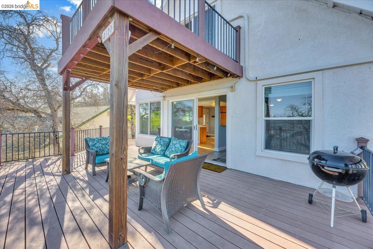 4620 Bayview Drive Copperopolis, CA 95228 - Photo 42 of 59 Wooden deck featuring a grill and an outdoor hangout area