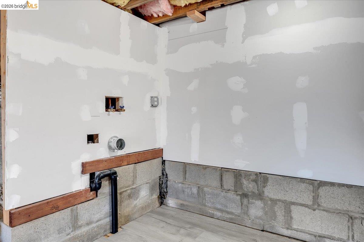 4620 Bayview Drive Copperopolis, CA 95228 - Photo 46 of 59 Washroom with washer hookup and concrete block wall