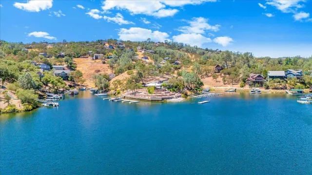 a view of a house with snow on the side of the road
