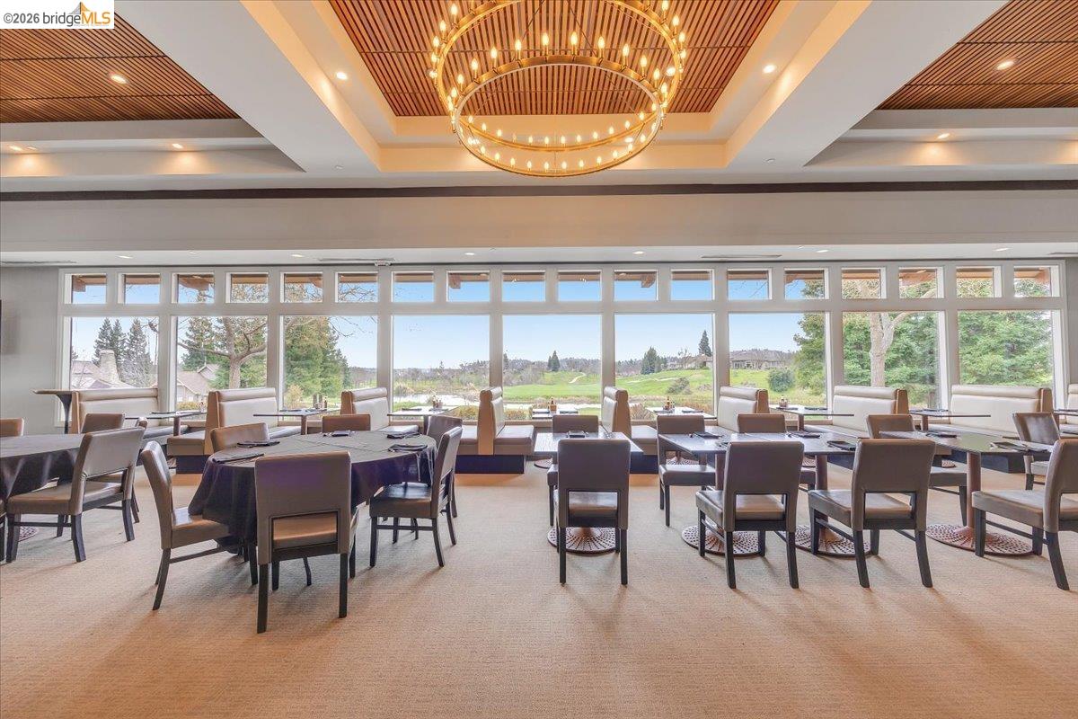 4620 Bayview Drive Copperopolis, CA 95228 - Photo 51 of 59 a room with lots of tables a large window and chairs