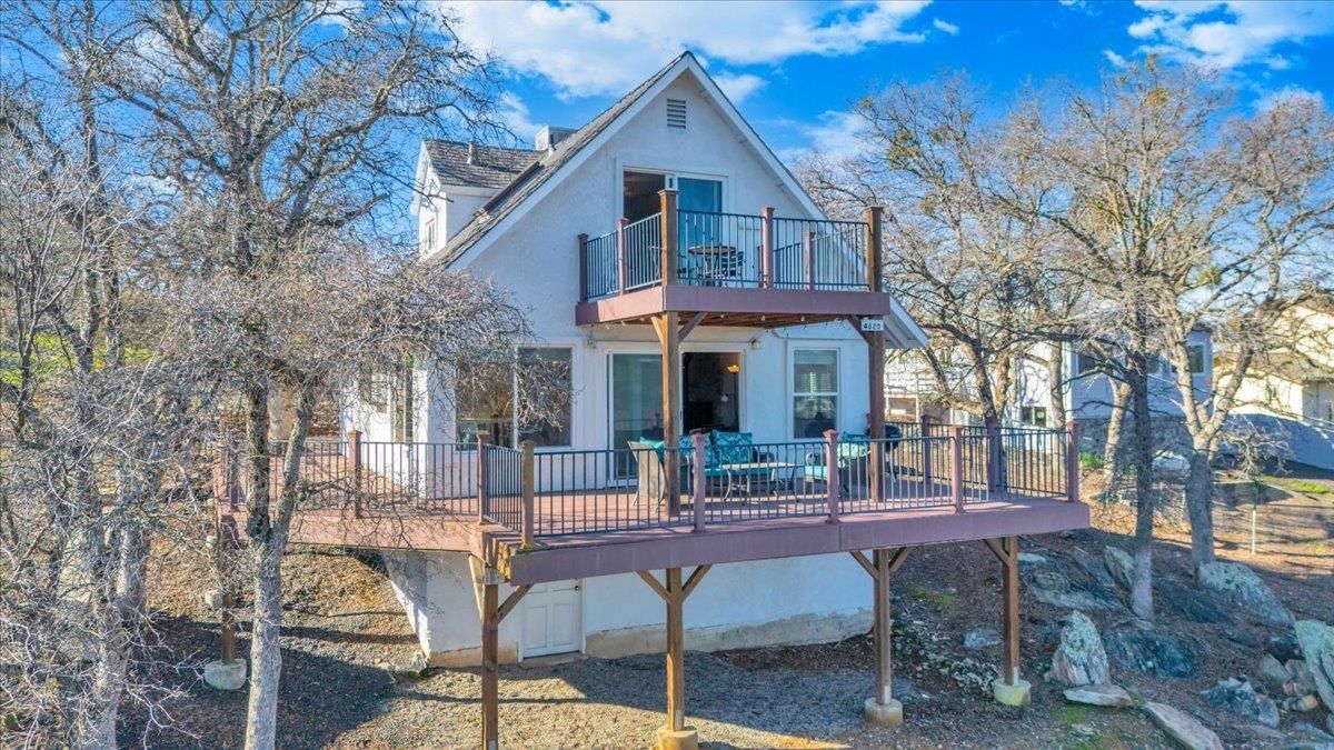 4620 Bayview Drive Copperopolis, CA 95228 - Photo 58 of 59 Rear view of property with a wooden deck and stucco siding