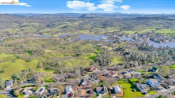 a kitchen with stainless steel appliances granite countertop a refrigerator stove top oven and sink