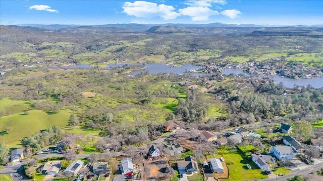 an aerial view of a house with a yard