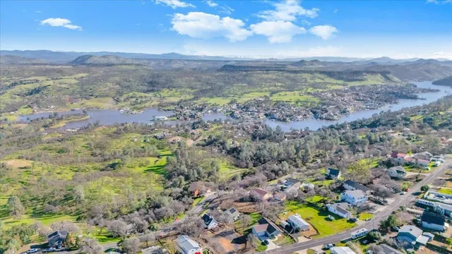a kitchen with stainless steel appliances granite countertop a stove top oven a sink a counter space and cabinets