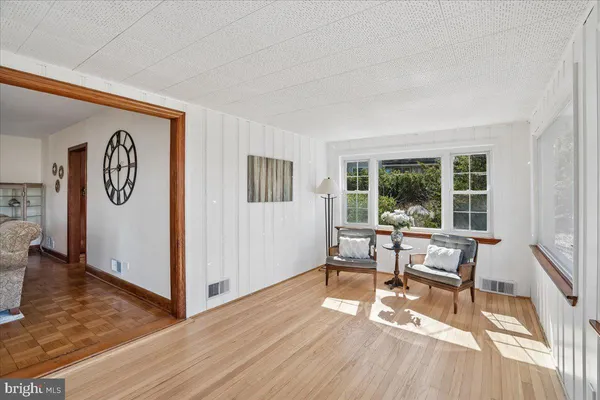 a bedroom with a bed a desk and chair