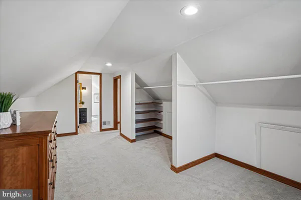 a view of a house with a yard covered in snow