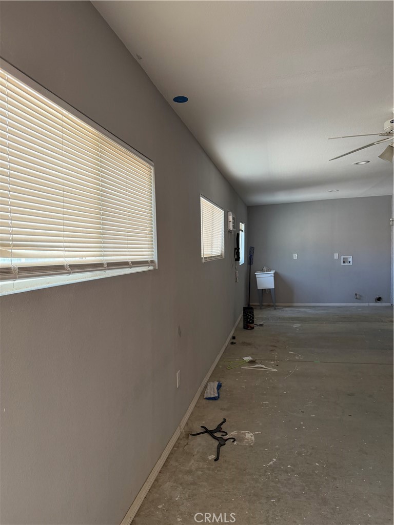 18602 Cocqui Road Apple Valley, CA 92307 - Photo 14 of 16 an empty room with windows