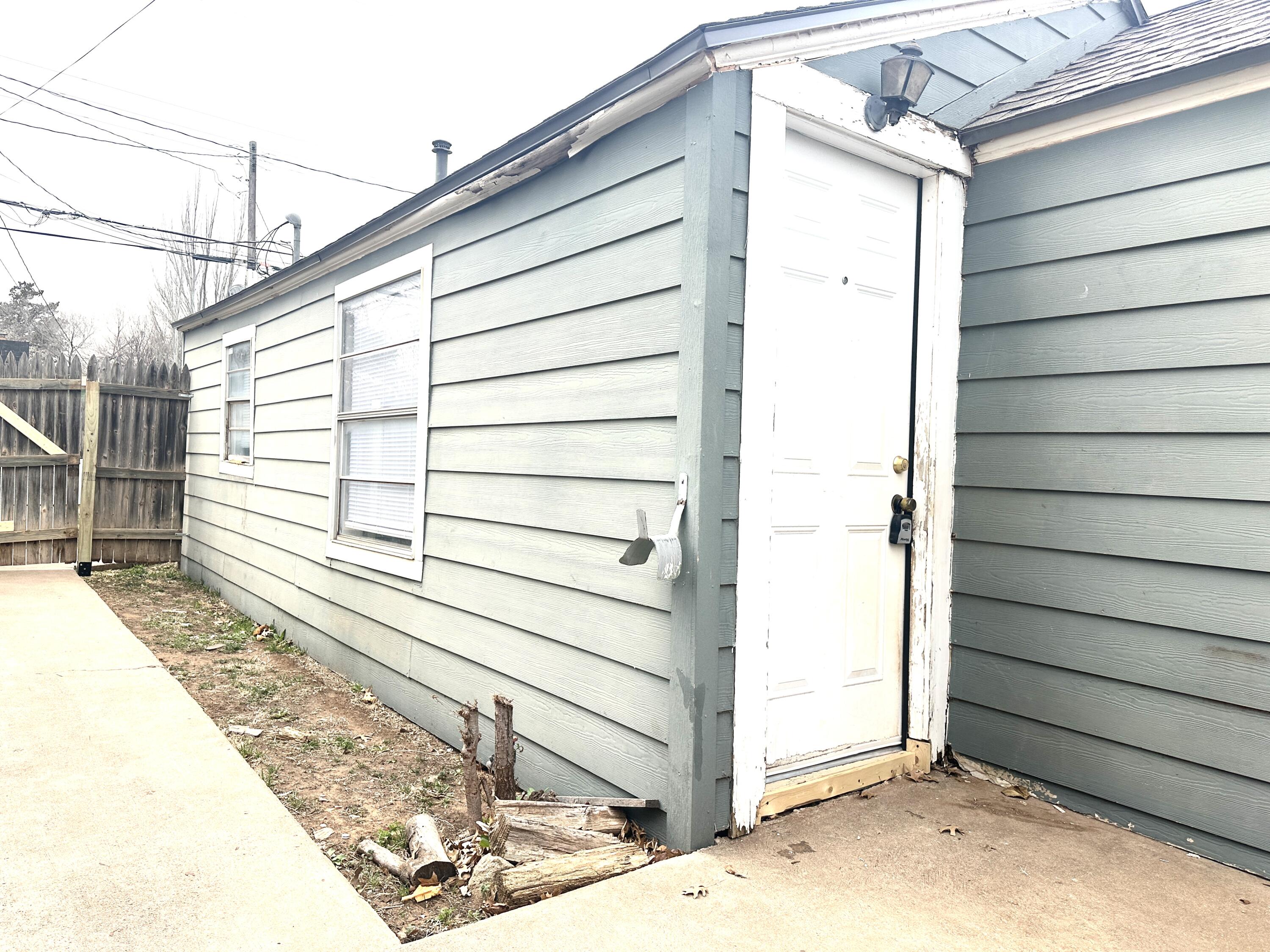 2305 27th Street, Unit REAR Lubbock, TX 79411 - Photo 1 of 8 a view of a house with a garage
