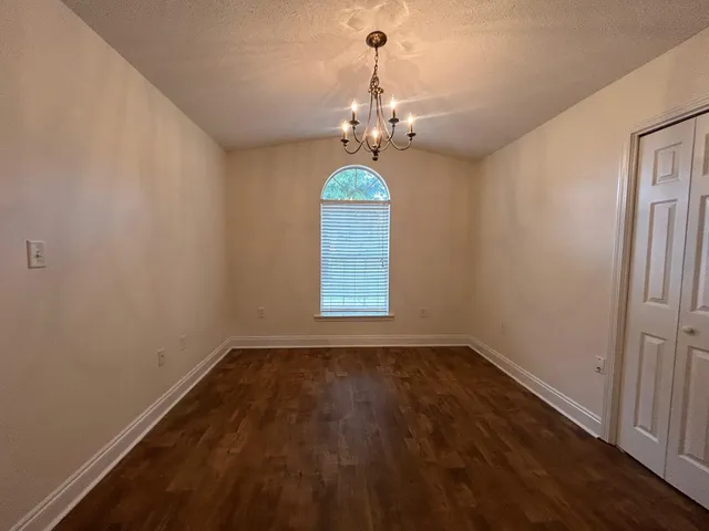 a view of a windows and chandelier in a room