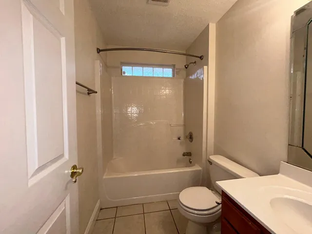 a view of a bathroom from a hallway
