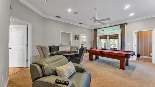 a spacious bedroom with a bed a couch and dresser