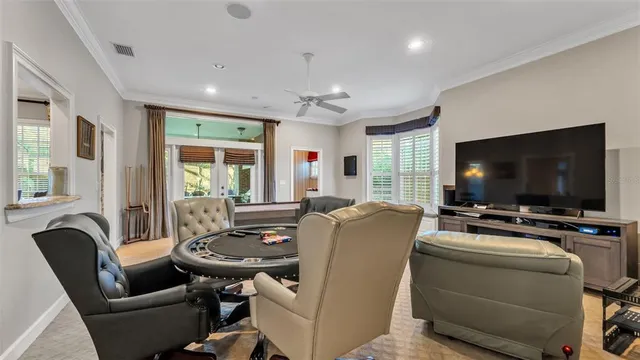 a bedroom with a bed couch and window